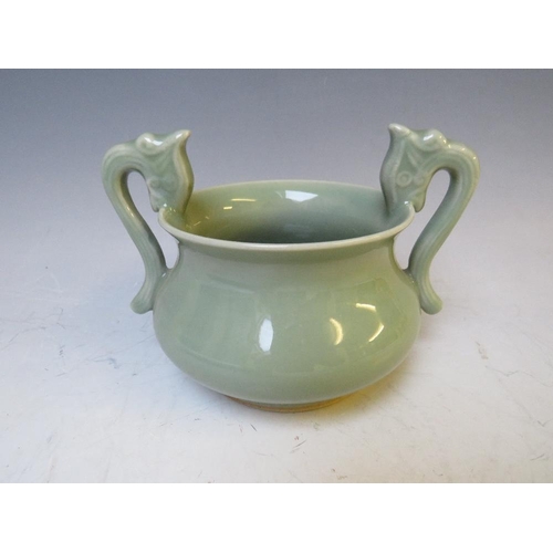 540 - AN ORIENTAL TWIN HANDLED CELADON CENSOR, H 10.5 cm, W 15 cm