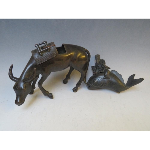 542 - A BRONZE ORIENTAL CENSOR, modelled as an ox with removable saddle, L 22 cm, together with a Buddha o... 