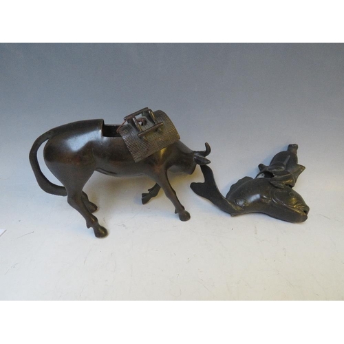 542 - A BRONZE ORIENTAL CENSOR, modelled as an ox with removable saddle, L 22 cm, together with a Buddha o... 