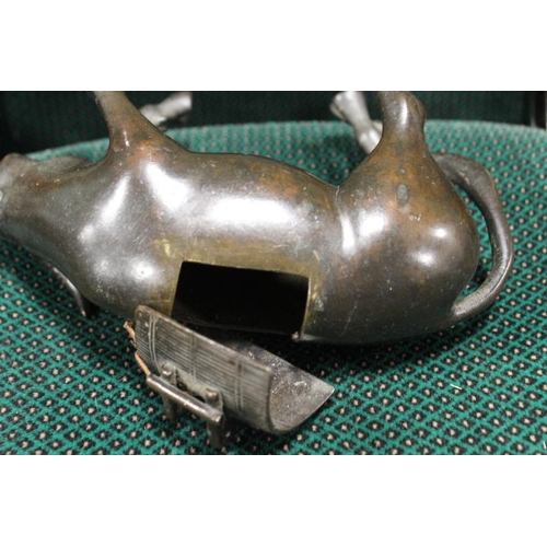 542 - A BRONZE ORIENTAL CENSOR, modelled as an ox with removable saddle, L 22 cm, together with a Buddha o... 