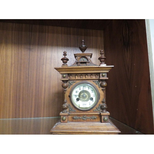 254 - A VINTAGE OAK CASED MANTLE CLOCK