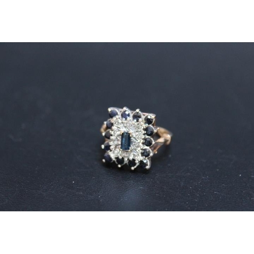 440 - A SAPPHIRE AND DIAMOND DRESS RING, set on an unmarked yellow metal band, ring size K