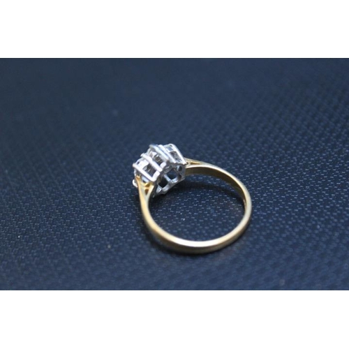 441 - A HALLMARKED 18 CARAT GOLD DIAMOND 'DAISY' RING, set with seven diamonds totalling an estimated 0.33... 