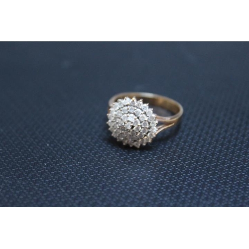 442 - A HALLMARKED 9 CARAT GOLD DIAMOND CLUSTER RING, set with an estimated half carat of diamonds, approx... 