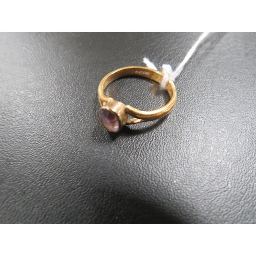 461 - A HALLMARKED 22 CARAT GOLD BAND WITH HAND MADE SPILT SET OVAL AMETHYST approx weight 4.2g RING SIZE ... 