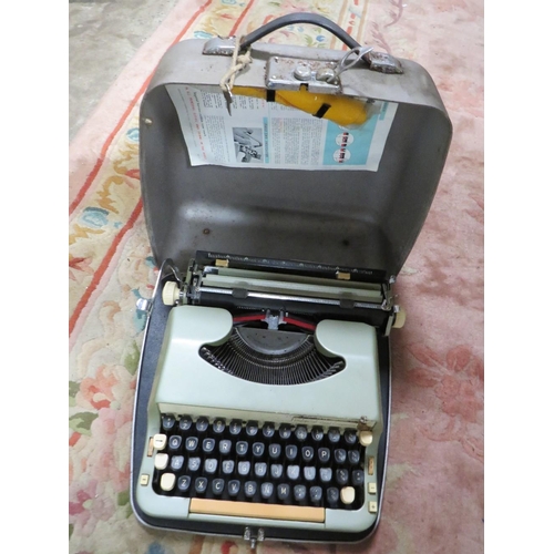 100 - A VINTAGE BREXTON CASED PICNIC SET TOGETHER WITH A CASED TYPEWRITER