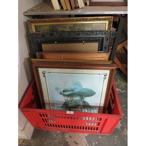 38 - A RED CRATE OF ASSORTED PICTURES TO INCLUDE A MIRROR