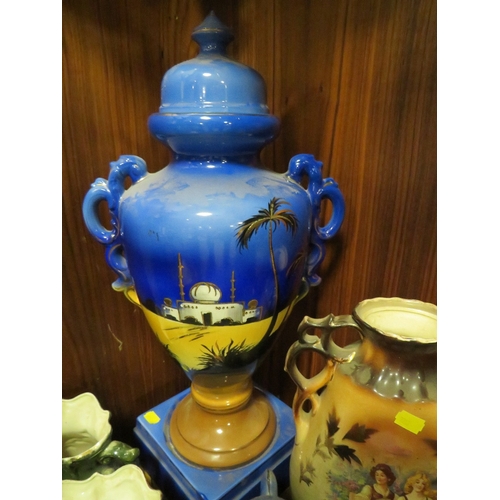 214 - A  COLLECTION OF DECORATIVE VASES , TWIN HANDLE VASES TO INCLUDE A TWIN HANDLE URN ON A PEDESTAL STA... 