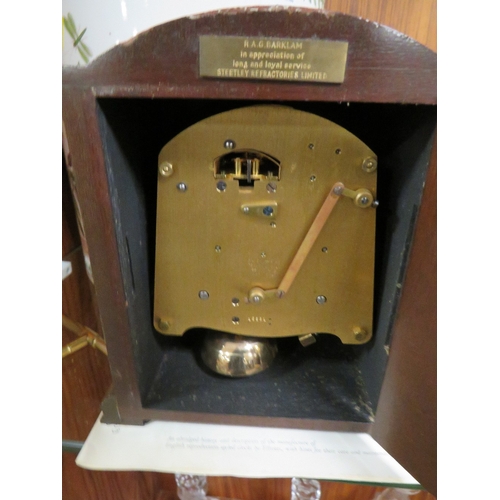 268 - A WOODEN CASED ELLIOTT MANTLE CLOCK RETAILED BY GARRARD AND CO LIMITED WITH KEY AND BOOKLET