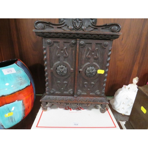 269 - A DECORATIVE CARVED WOODEN CABINET TOGETHER WITH TWO SPODE PLATES