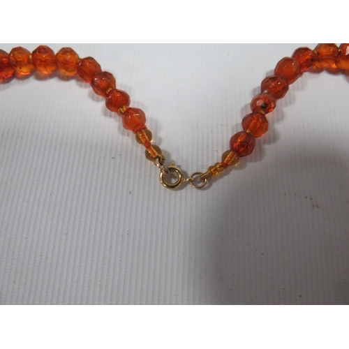 308 - AN ART DECO STYLE AMBER FACETED BEAD NECKLACE