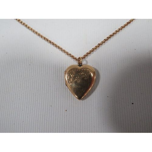 316 - AN ANTIQUE LOCKET MARKED 9CT BACK AND FRONT