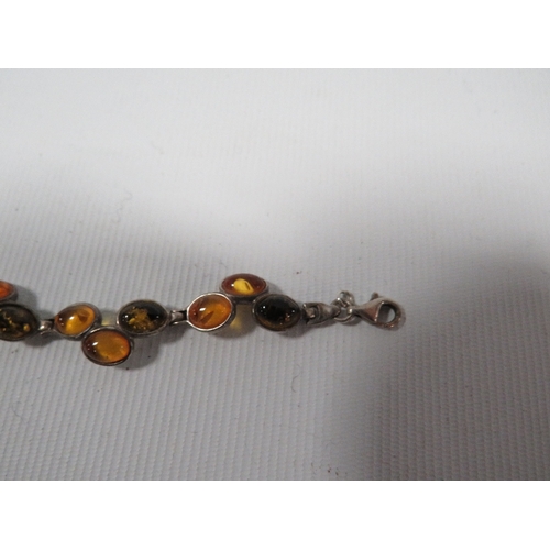 339 - A SILVER MULTICOLOURED AMBER SET PANEL LINK BRACELET