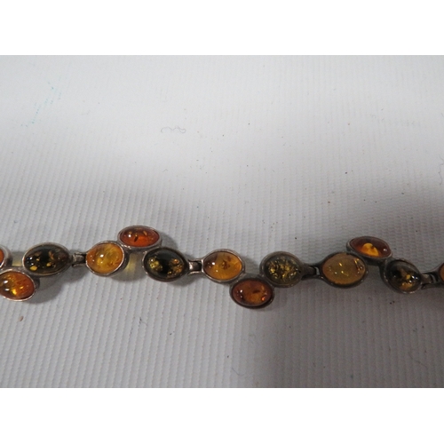 339 - A SILVER MULTICOLOURED AMBER SET PANEL LINK BRACELET