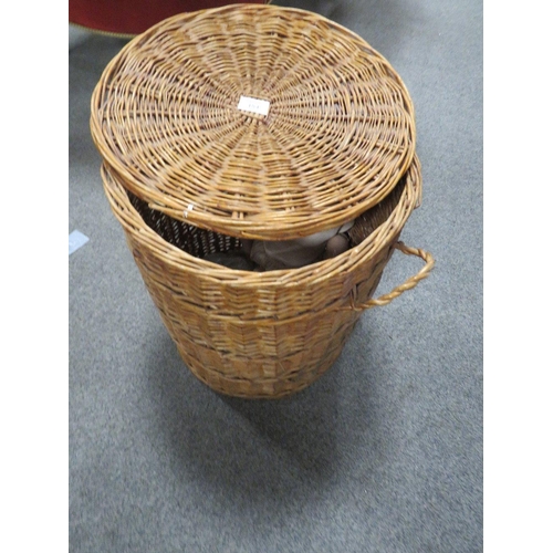 154 - A VINTAGE ARMAND MARSEILLE CERAMIC HEADED DOLL CONTAINED IN A WICKER BASKET