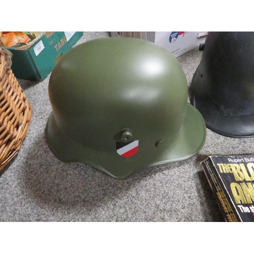 156 - A QUANTITY OF REPRODUCTION MILITARY HELMETS TOGETHER WITH A QUANTITY OF MILITARY BOOKS