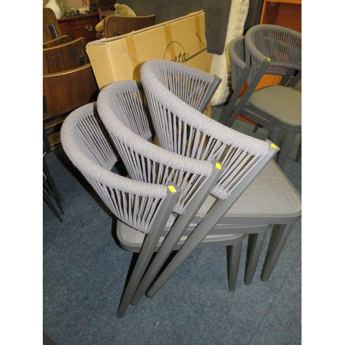 773 - FIVE MODERN STACKING PATIO CHAIRS WITH A BOXED 'ARES' TABLE