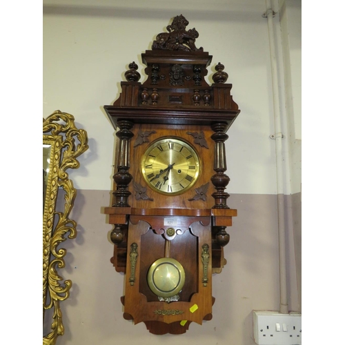 821 - AN EDWARDIAN WALNUT WALL CLOCK