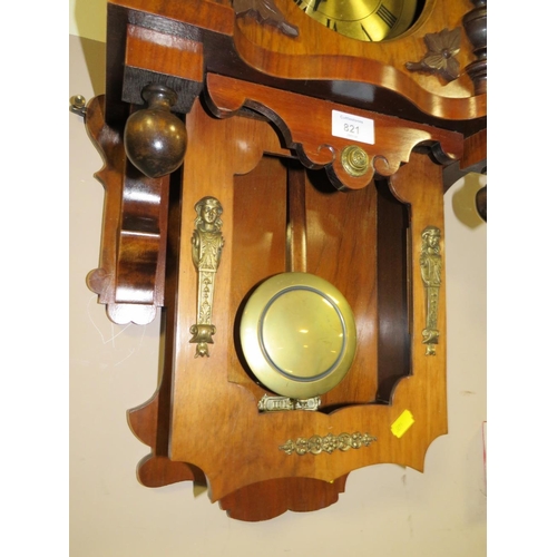 821 - AN EDWARDIAN WALNUT WALL CLOCK