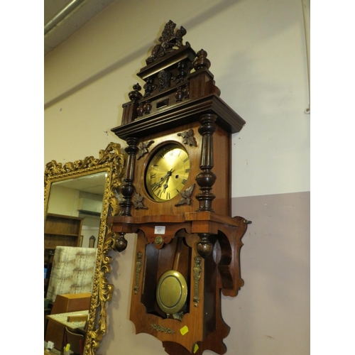 821 - AN EDWARDIAN WALNUT WALL CLOCK