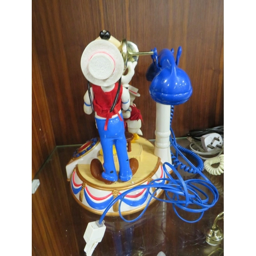 216 - A VINTAGE DISNEY MICKEY'S DIXIE LAND BAND AUTOMATON MUSICAL TELEPHONE TOGETHER WITH A VINTAGE BELL R... 