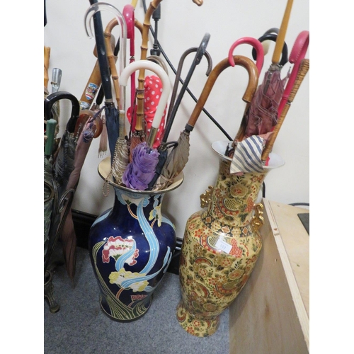 222 - TWO LARGE CERAMIC VASES CONTAINING A COLLECTION OF VINTAGE PARASOLS