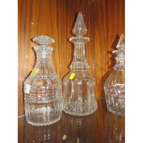 246 - A COLLECTION OF GEORGIAN CUT GLASS DECANTERS