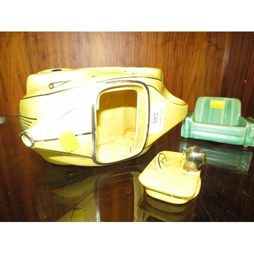 248 - A VINTAGE SADLER RACING CAR TEAPOT IN YELLOW, TOGETHER WITH TWO SIMILAR STYLE SOFAS (3)