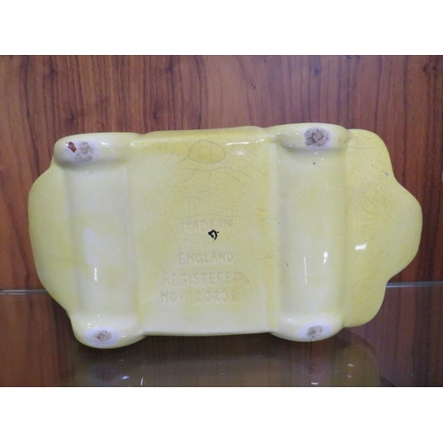 248 - A VINTAGE SADLER RACING CAR TEAPOT IN YELLOW, TOGETHER WITH TWO SIMILAR STYLE SOFAS (3)