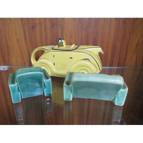 248 - A VINTAGE SADLER RACING CAR TEAPOT IN YELLOW, TOGETHER WITH TWO SIMILAR STYLE SOFAS (3)