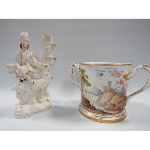 280 - A STAFFORDSHIRE FLATBACK FIGURE A/F TOGETHER WITH A LARGE HAND PAINTED TWIN HANDLED LOVING CUP