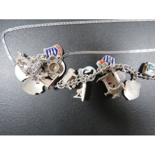 315 - A SILVER CHARM BRACELET AND TWO SILVER NECK CHAINS