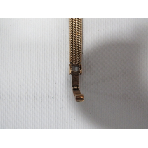 337 - A HALLMARKED 9 CARAT GOLD GARRARD WRIST WATCH A/F