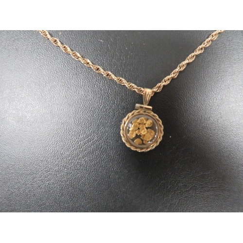 362 - A HALLMARKED 9 CARAT GOLD ROPE TWIST CHAIN WITH PENDANT CONTAINING FLAKES OF GOLD approx weight of c... 