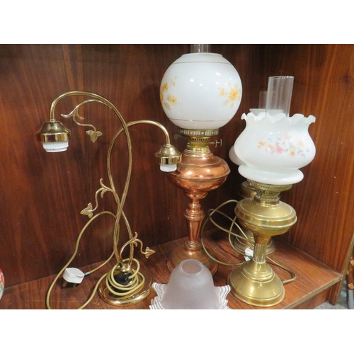 219 - A SELECTION OF CONVERTED OIL LAMPS TOGETHER WITH A TWO BRANCH TABLE LAMP