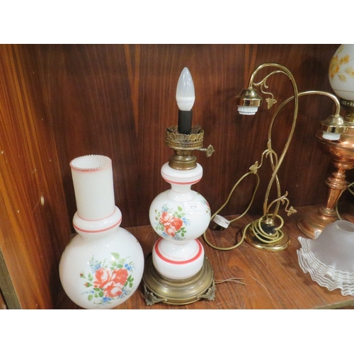 219 - A SELECTION OF CONVERTED OIL LAMPS TOGETHER WITH A TWO BRANCH TABLE LAMP