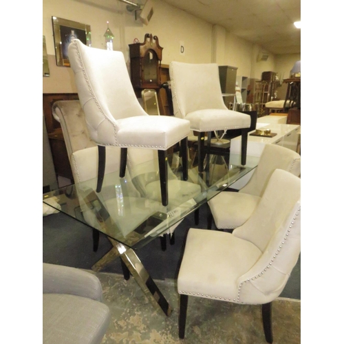 803 - A LARGE MODERN GLASS TOPPED TABLE WITH SIX UPHOLSTERED CHAIRS