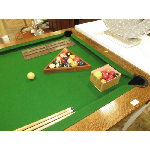 809 - A LARGE OAK SNOOKER / DINING / GAMES TABLE WITH CUES, BALLS ETC, TABLE 76 x 104 x 190 cm