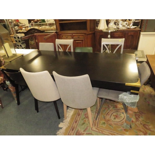 810 - A LARGE BLACK DINING TABLE WITH AN ASSORTMENT OF EIGHT CHAIRS