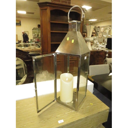 812 - A LARGE METAL CANDLE LANTERN H-84 CM