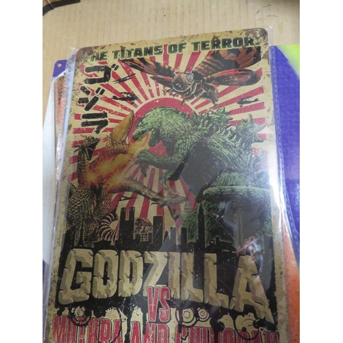 96 - A BOX OF MIXED METAL SIGNS TO INCLUDE GODZILLA ETC