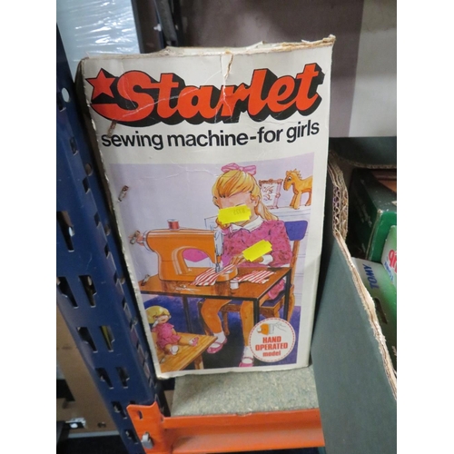 191 - A BOX CHILD'S STARLET SEWING MACHINE FOR GIRLS TOGETHER WITH A TRAY OF VINTAGE TOYS AND GAMES