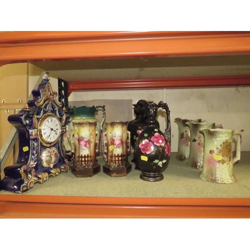 202 - AN ORNATE CERAMIC CLOCK TOGETHER WITH A COLLECTION OF VINTAGE JUGS AND VASES