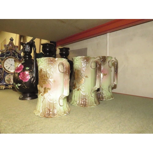 202 - AN ORNATE CERAMIC CLOCK TOGETHER WITH A COLLECTION OF VINTAGE JUGS AND VASES