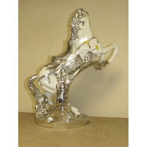 203 - A DECORATIVE SILVER AND WHITE REARING HORSE MODEL