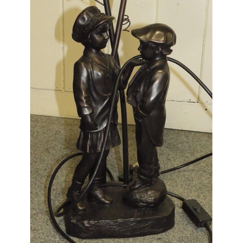 231 - A BRONZE EFFECT FIGURAL TABLE LAMP