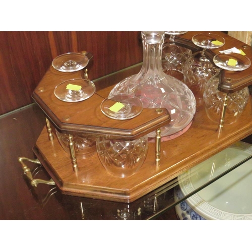 233 - A TWIN HANDLED DRINKS STAND WITH DECANTER AND SIX BRANDY GLASSES