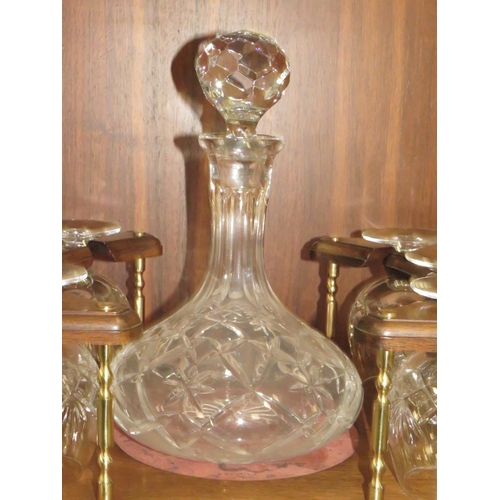 233 - A TWIN HANDLED DRINKS STAND WITH DECANTER AND SIX BRANDY GLASSES