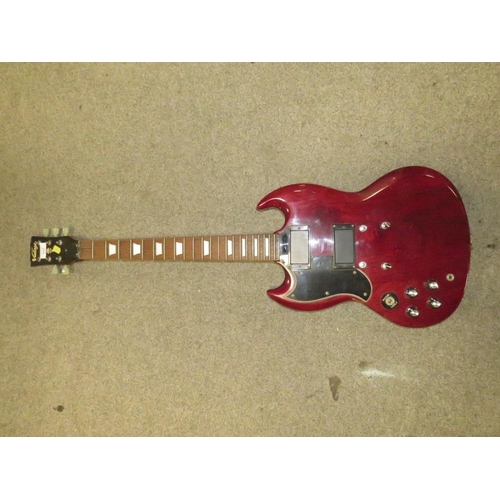 243 - A MAROON VINTAGE GUITAR