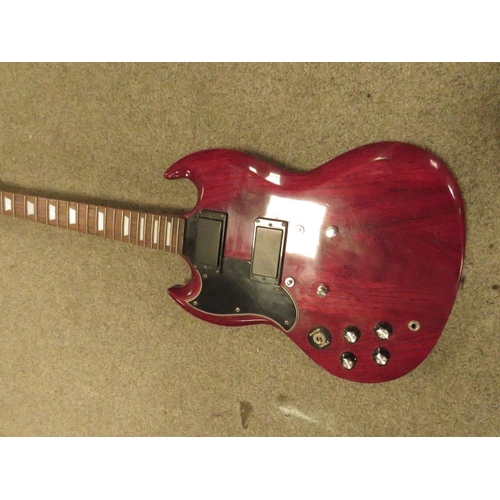 243 - A MAROON VINTAGE GUITAR